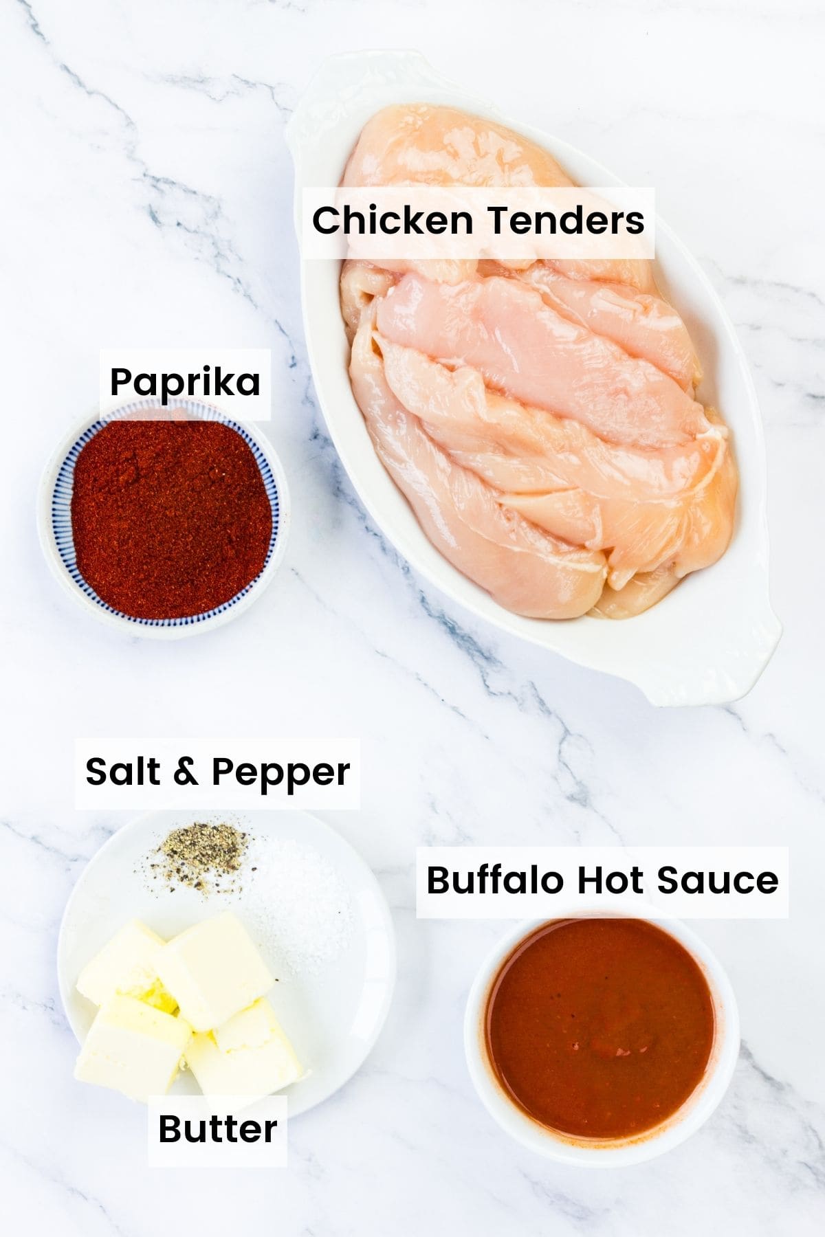 The ingredients for buffalo chicken tenders are shown portioned and labeled: chicken tenders, paprika, salt and pepper, butter, buffalo hot sauce.