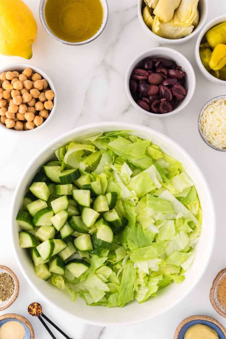 Chopped cucumbers are added.