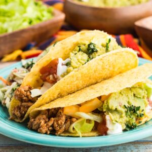 Two ground turkey tacos on a plate.