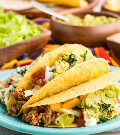 Taco shells are stuffed with turkey filling for ground turkey tacoes.
