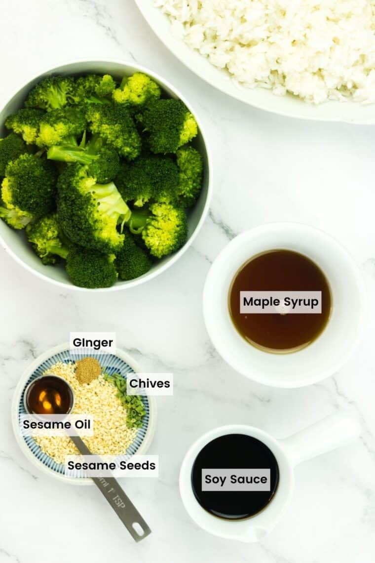 Ingredients to make maple sesame glaze on a countertop with text labels including soy sauce, maple syrup, sesame oil, chives, ginger, and sesame seeds.