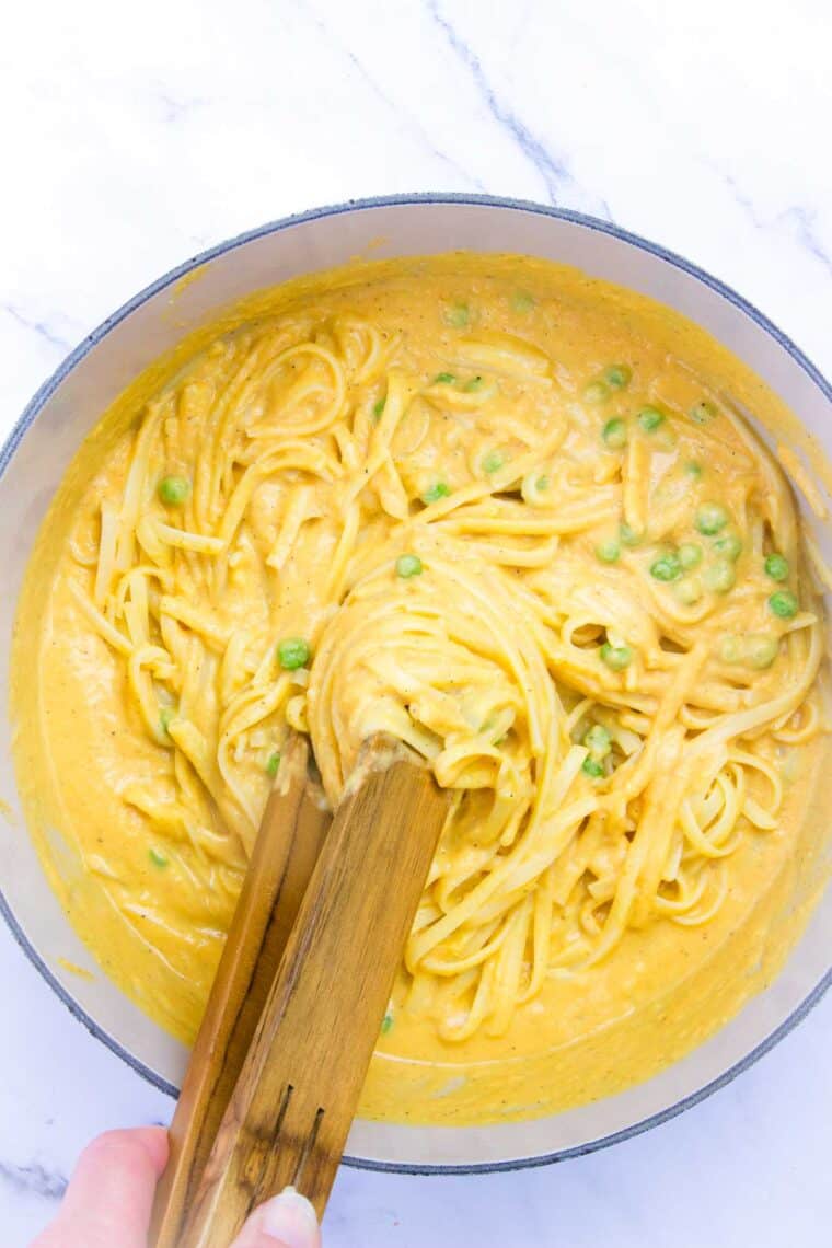 Noodles are mixed into the pumpkin sauce.