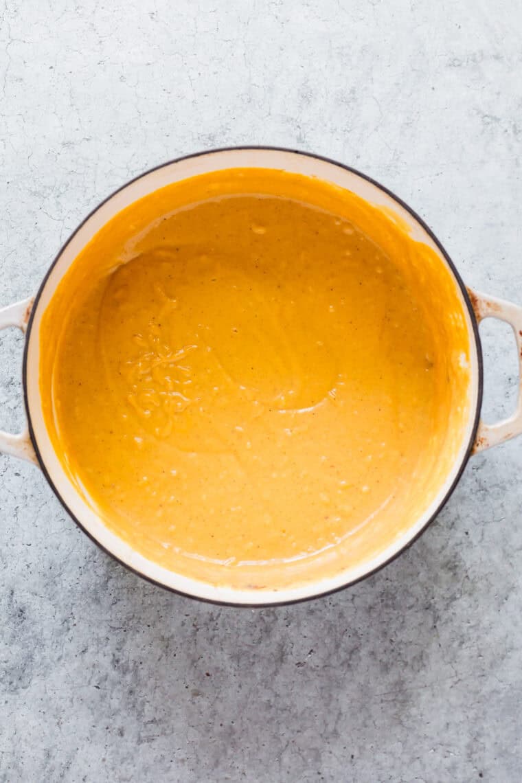 Pumpkin pudding is mixed in a pot.