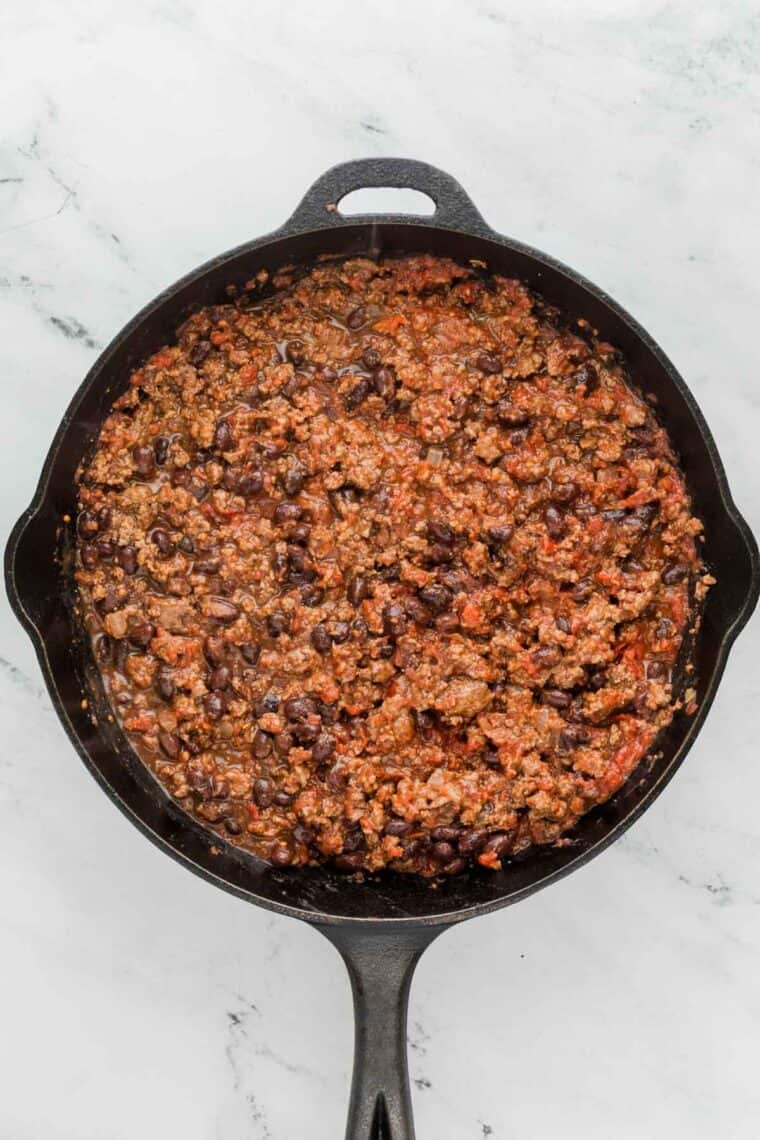 Ground beef in a cast iron pan.