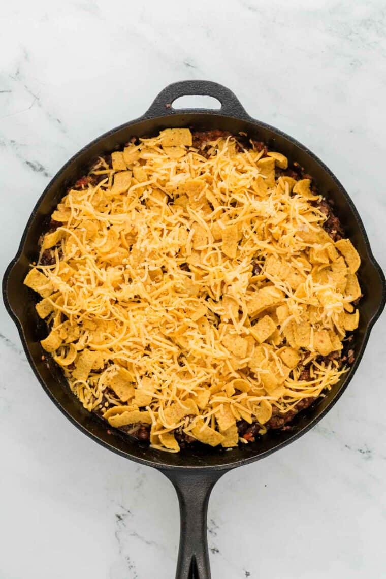 Shredded cheddar cheese tops the casserole.