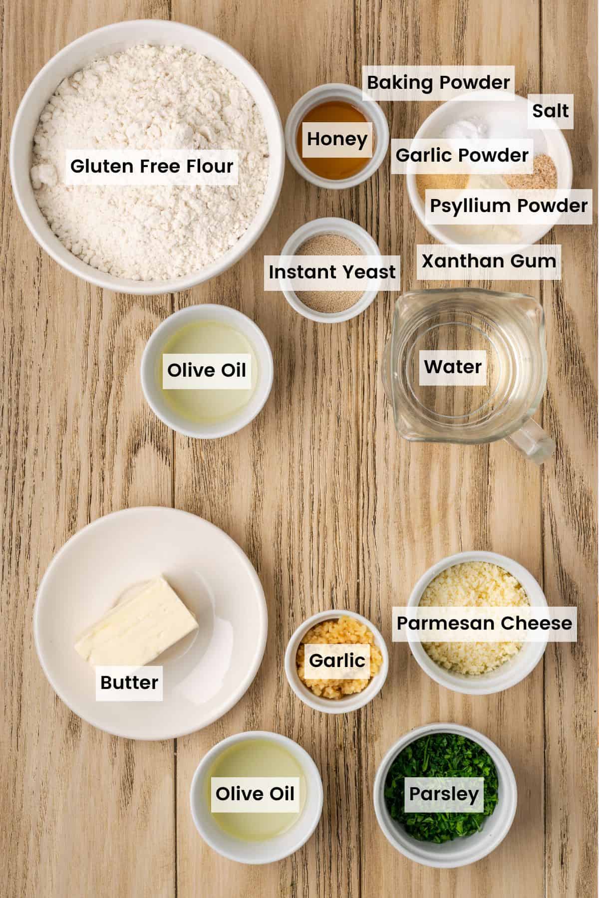 The ingredients for homemade gluten-free garlic knots portioned out with text labels.