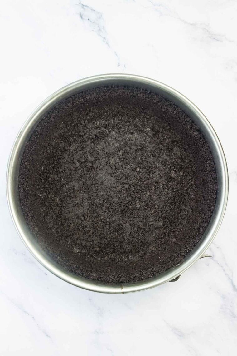 A springform pan with a gluten free oreo crust.