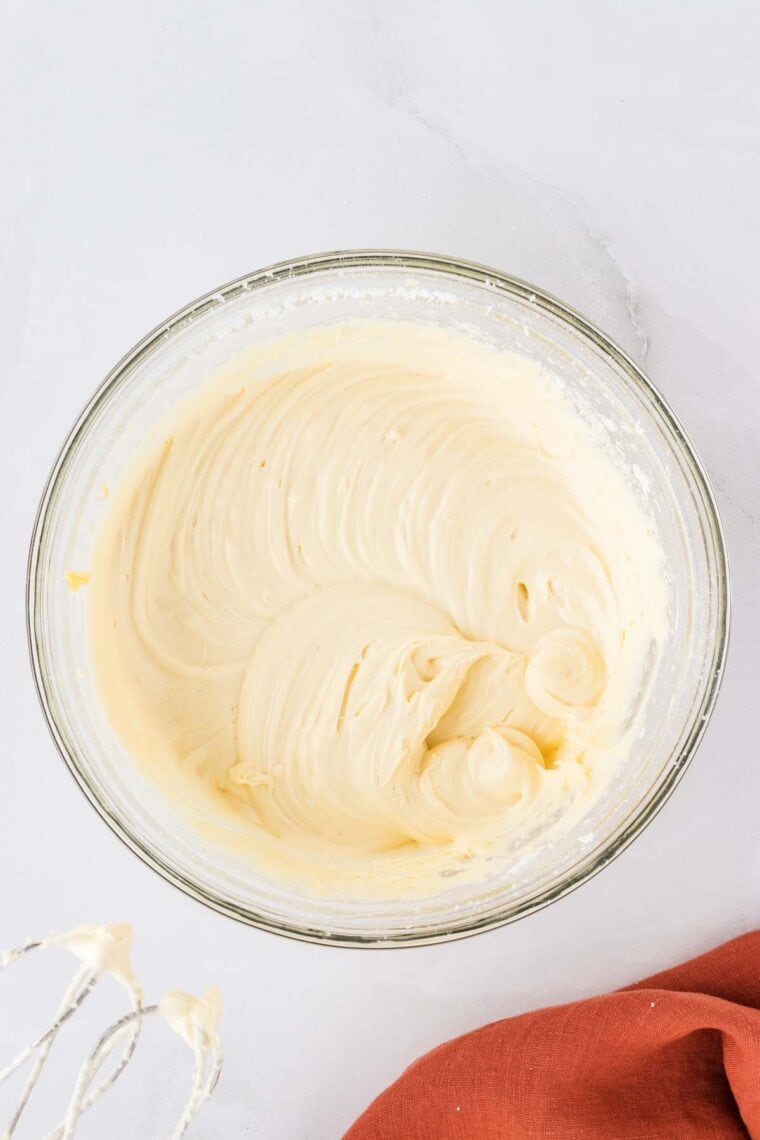 A bowl of cream cheese frosting.
