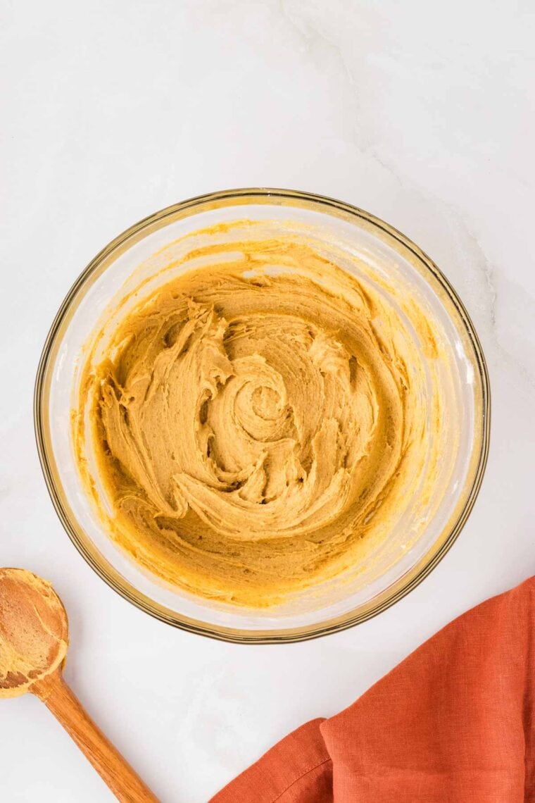 A bowl of pumpkin cookie dough.