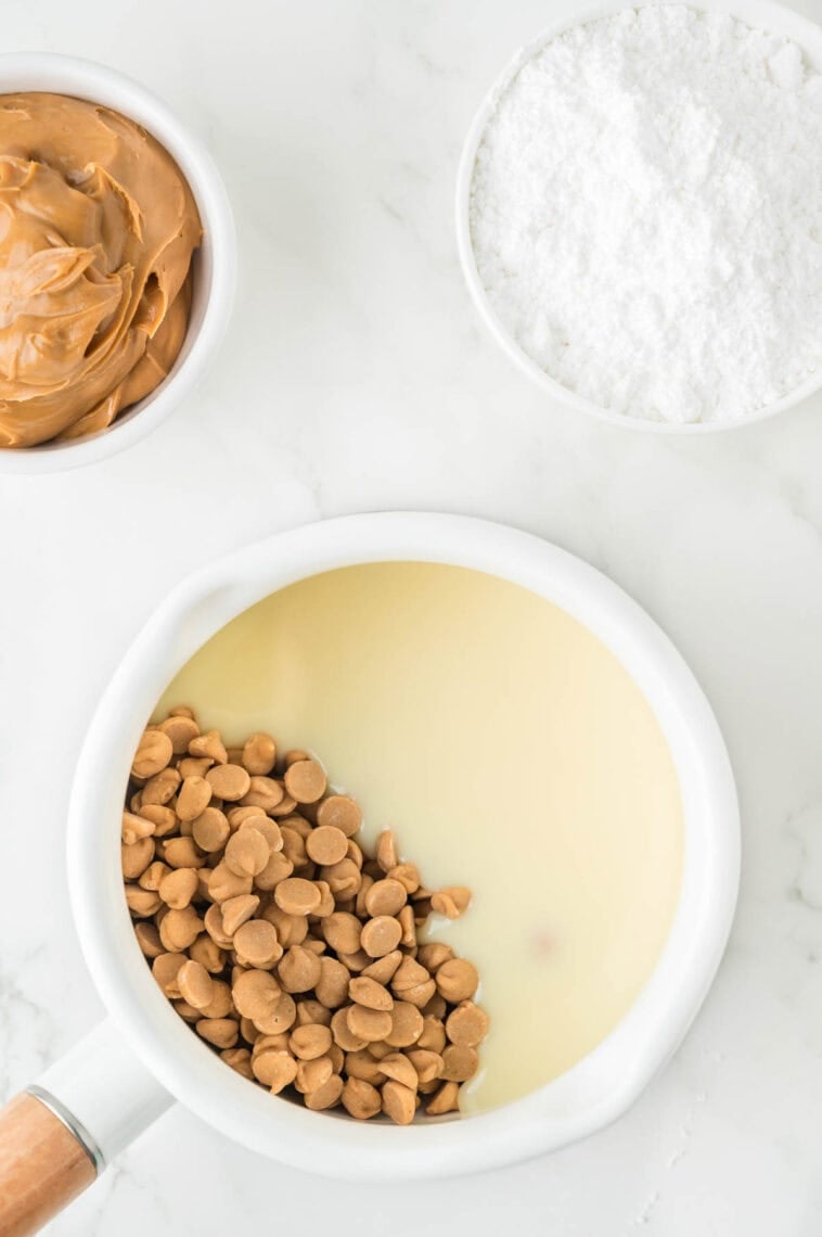 Peanuts are added to a pot of condensed milk.