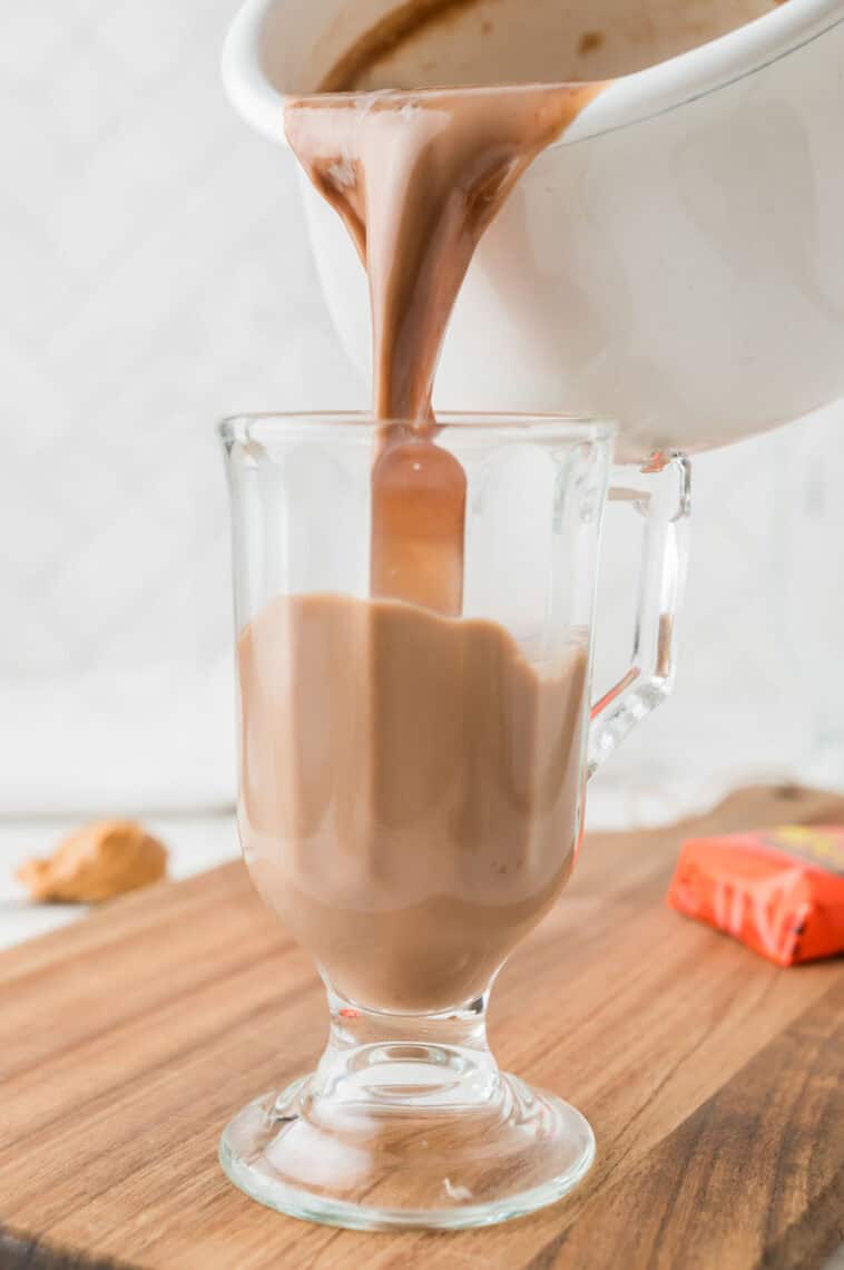 Peanut butter hot chocolate poured into a handled glass.