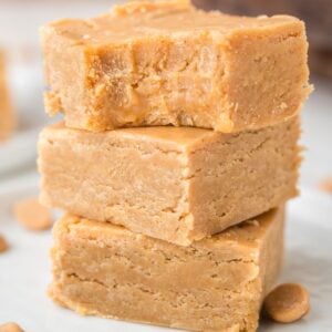 A piece of peanut butter fudge with a bite taken out.