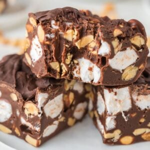 A stack of rocky road fudge on a white plate.