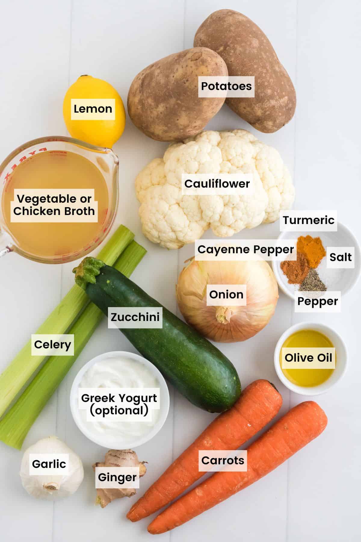 Vegetables, spices, and broth on a table with text labels.