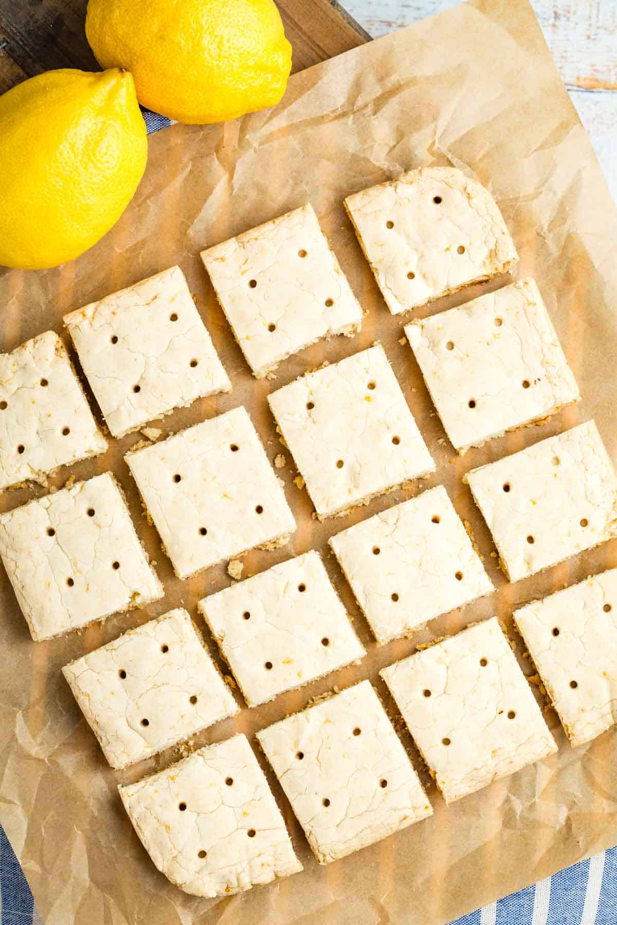 Sixteen squares of lemon shortbread cookies.