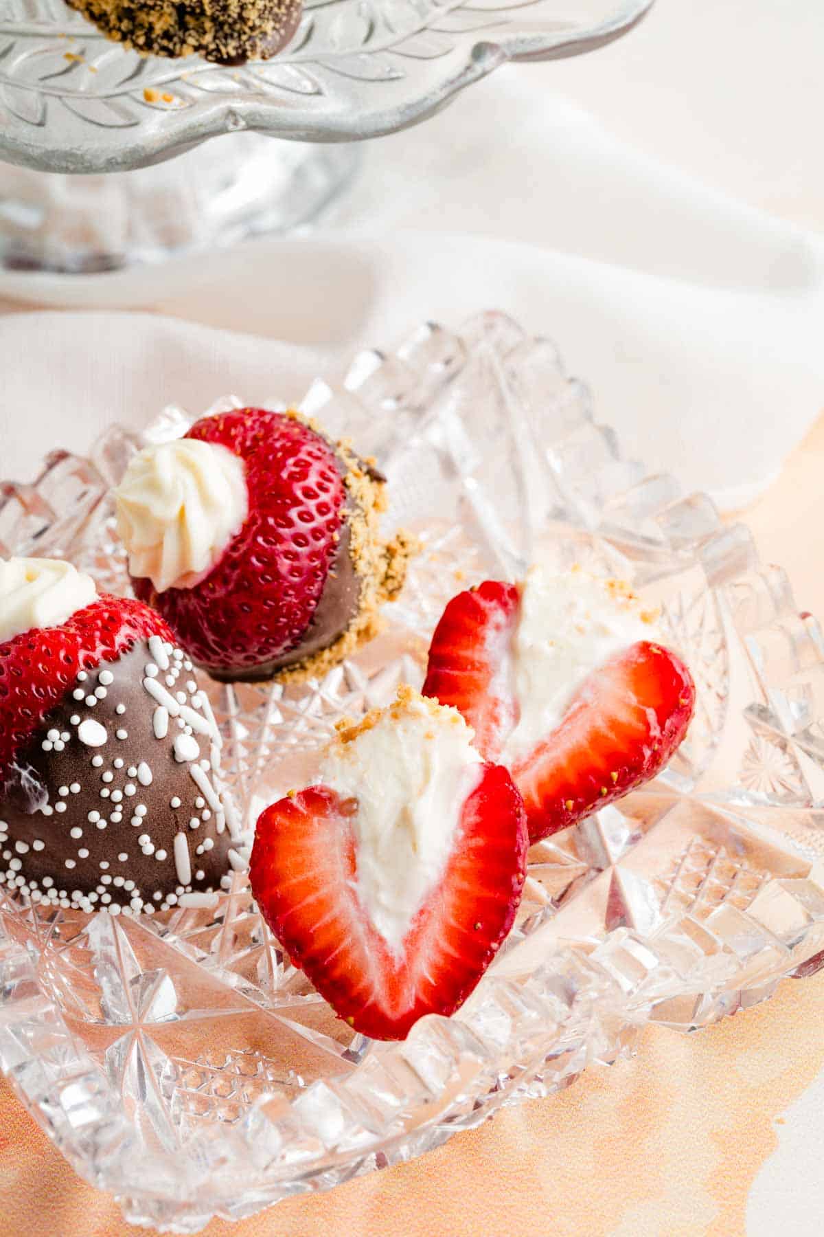 Cream cheese filling is shown in halved strawberries.