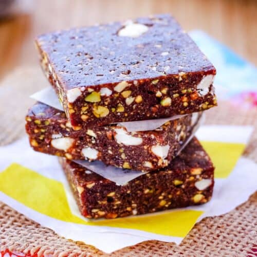 Three cherry energy bars stacked on top of each other.