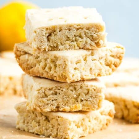 A stack of square cookies with text overlay that says "Gluten Free Lemon Shortbread".