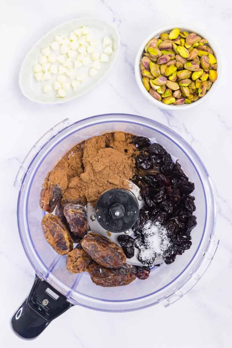Cherry energy bars ingredients added to a food processor.