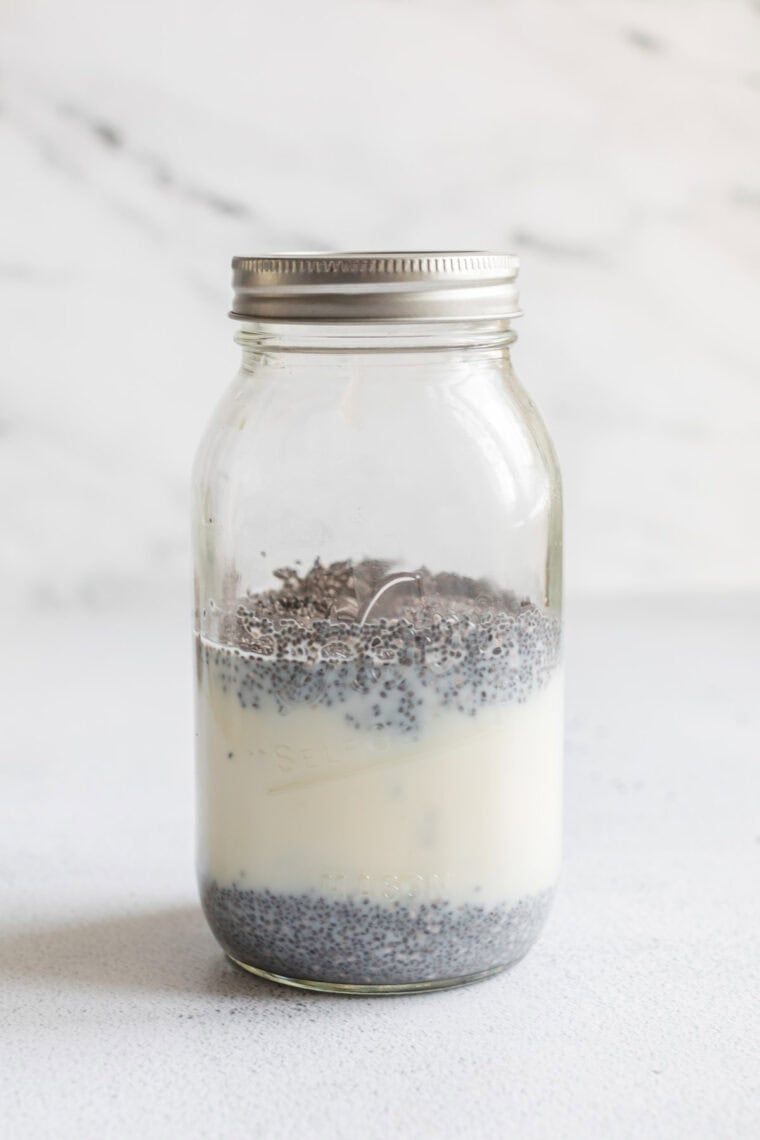 The ingredients for chia seed pudding in a lidded mason jar.
