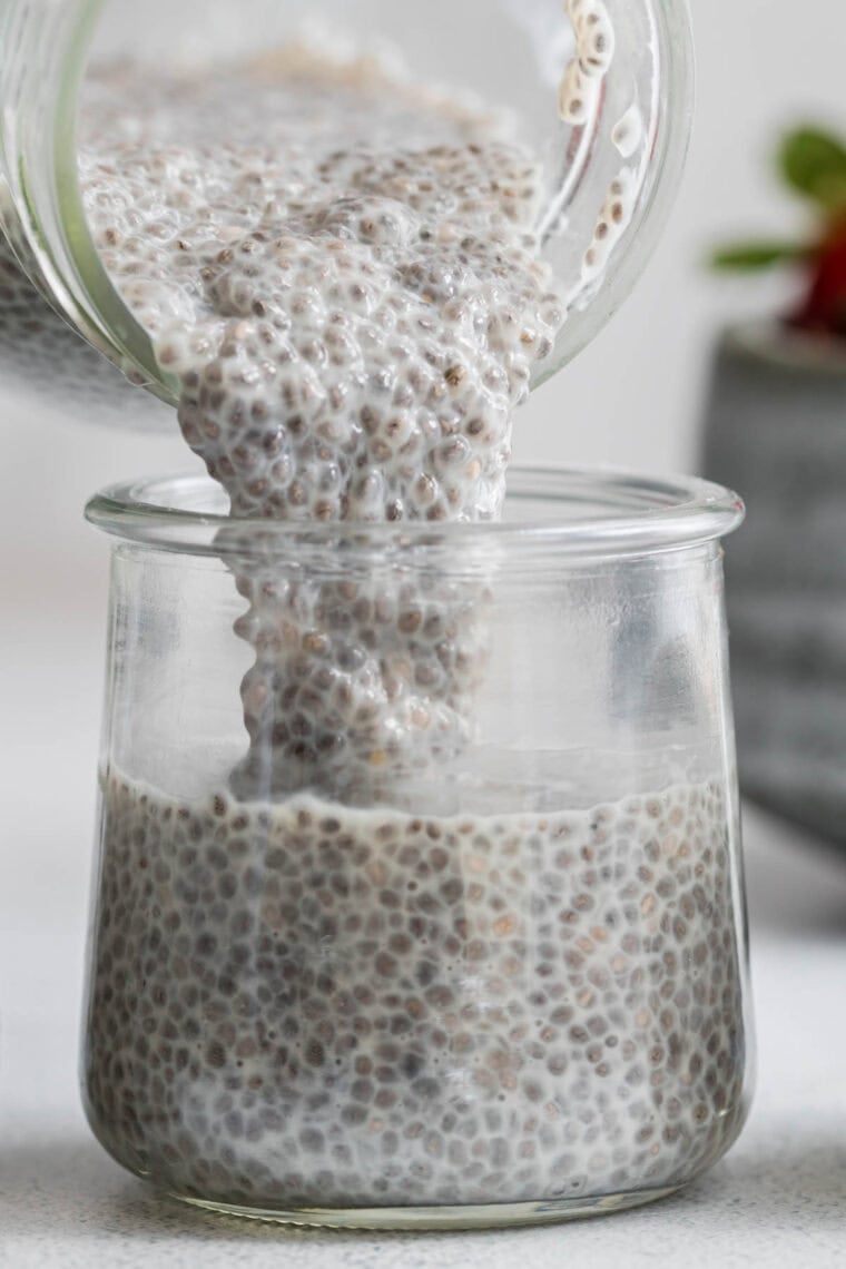 Chia seed pudding is poured into a jar.