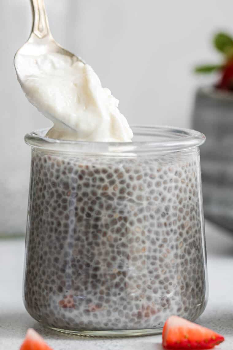 Yogurt added to a portion of chia seed pudding.