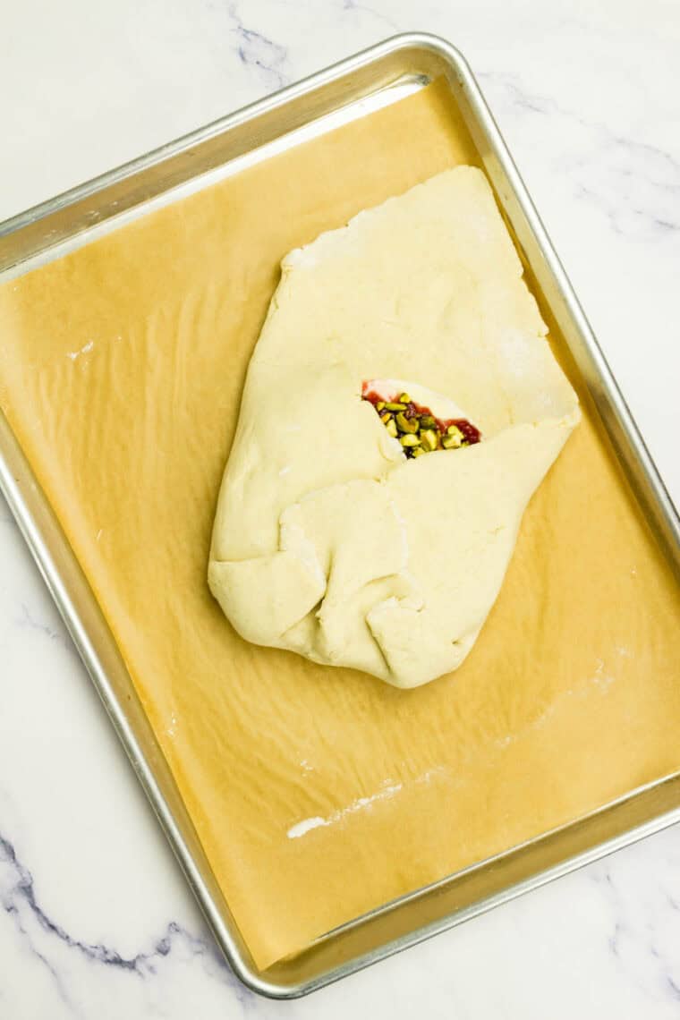 Crescent dough is folded around brie.