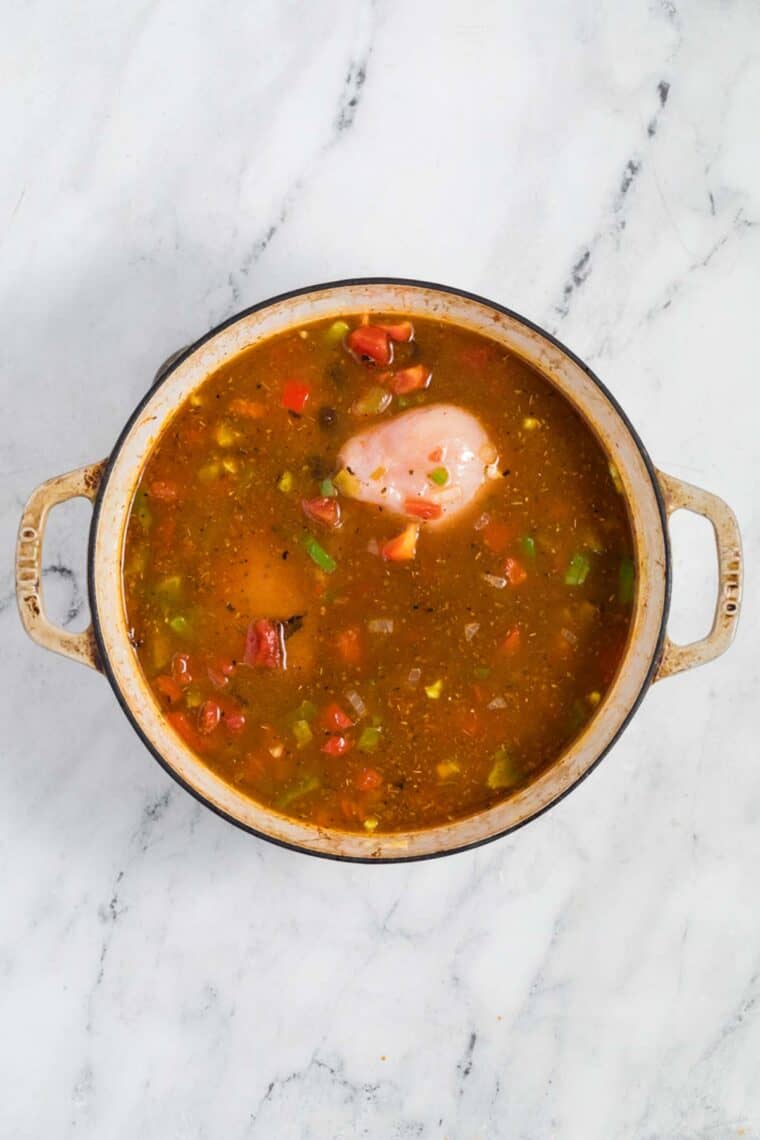 Chicken is added to a pot of chicken taco soup.