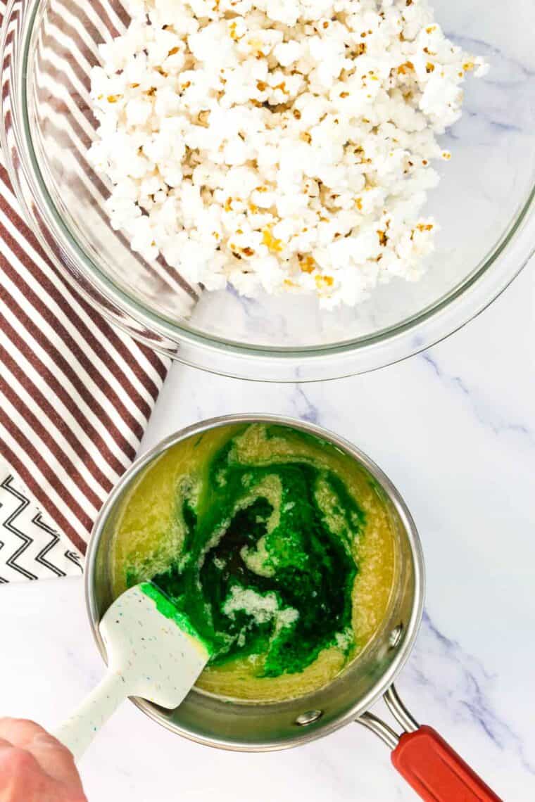 Green food coloring stirred into melted butter and honey.