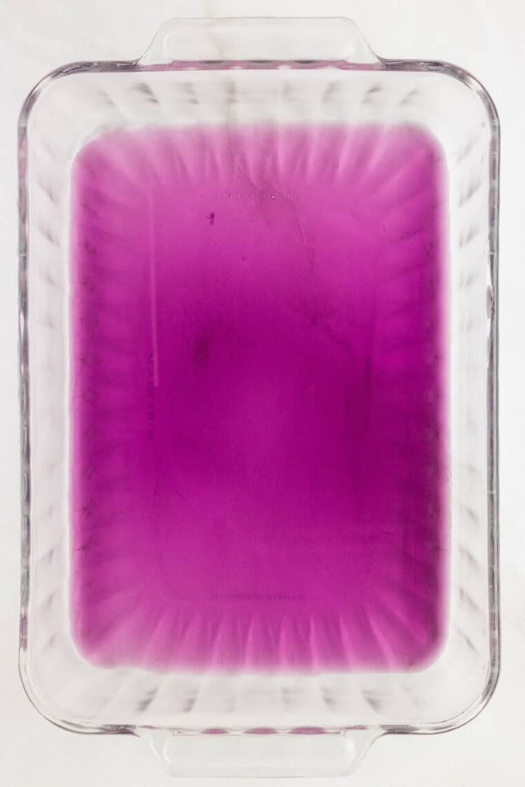 Pour cooled, prepared jello into a greased pan.