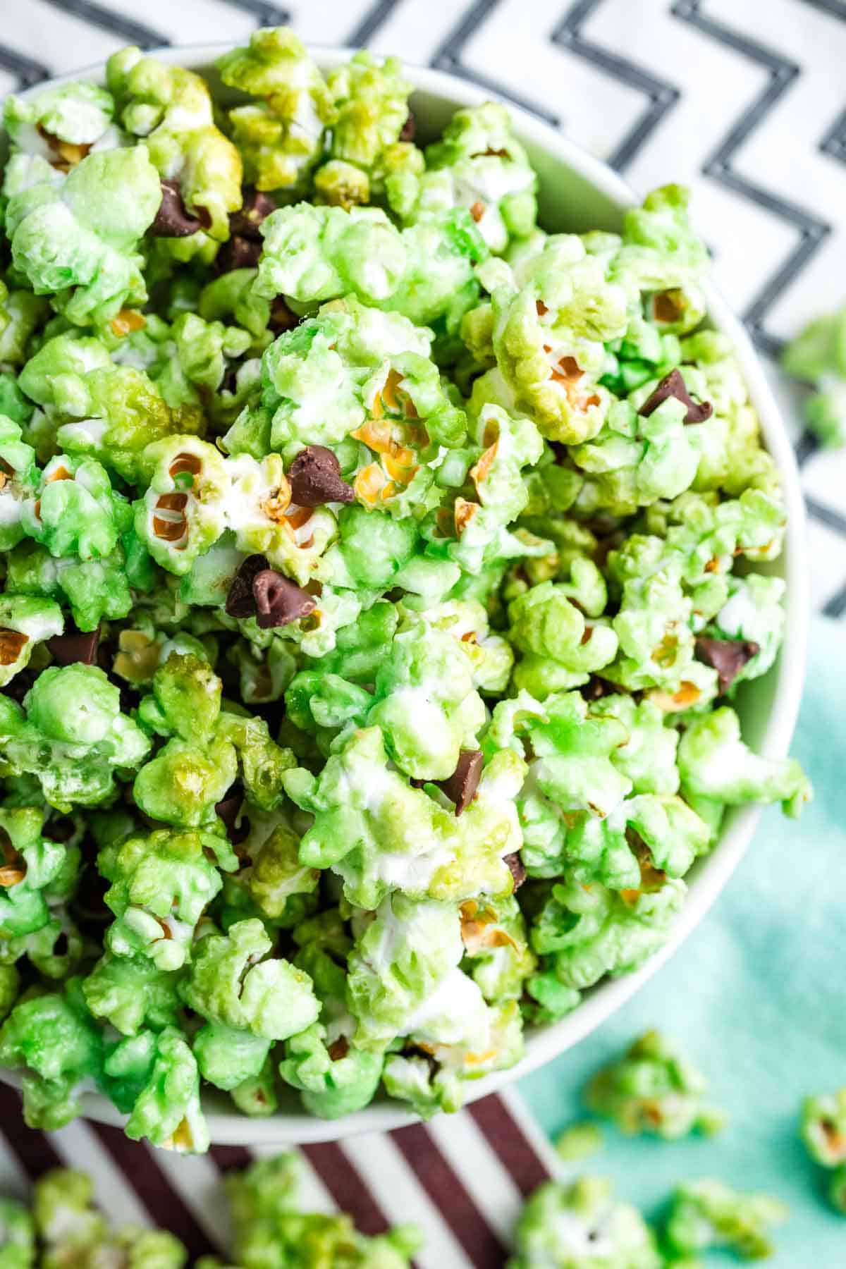 A bowl of green popcorn.