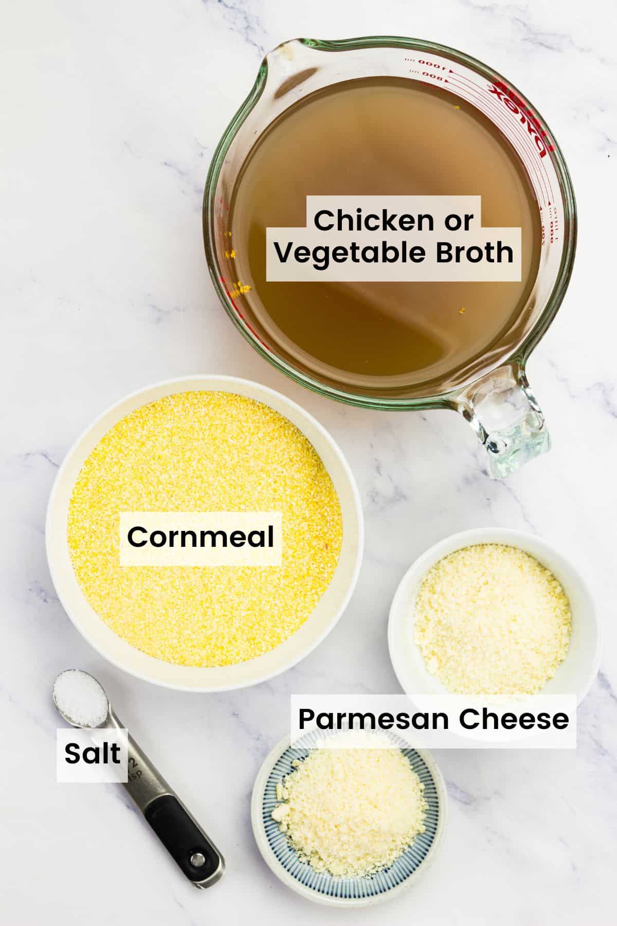 Ingredients to make baked polenta portioned out with text labels.