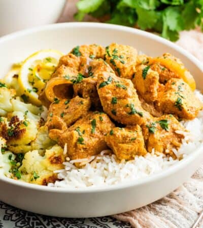 A bowl of slow cooker butter chicken and rice.