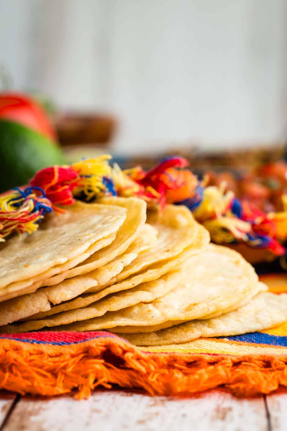 A few corn tortillas on a towel.