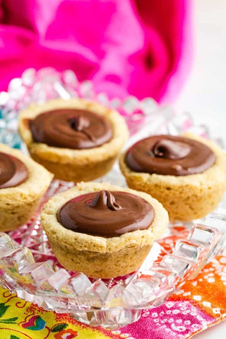Gluten free sugar cookie cups filled with chocolate ganache.