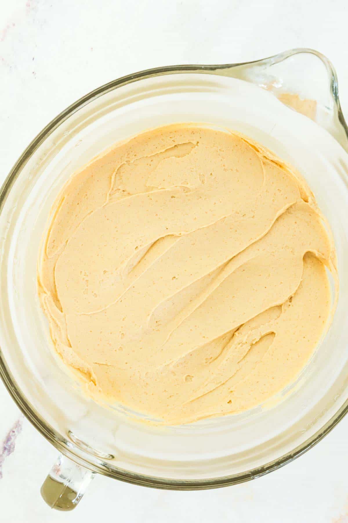 Peanut butter frosting in a bowl.