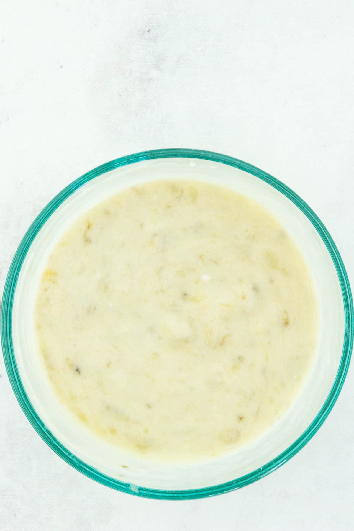 A bowl of creamy banana filling.