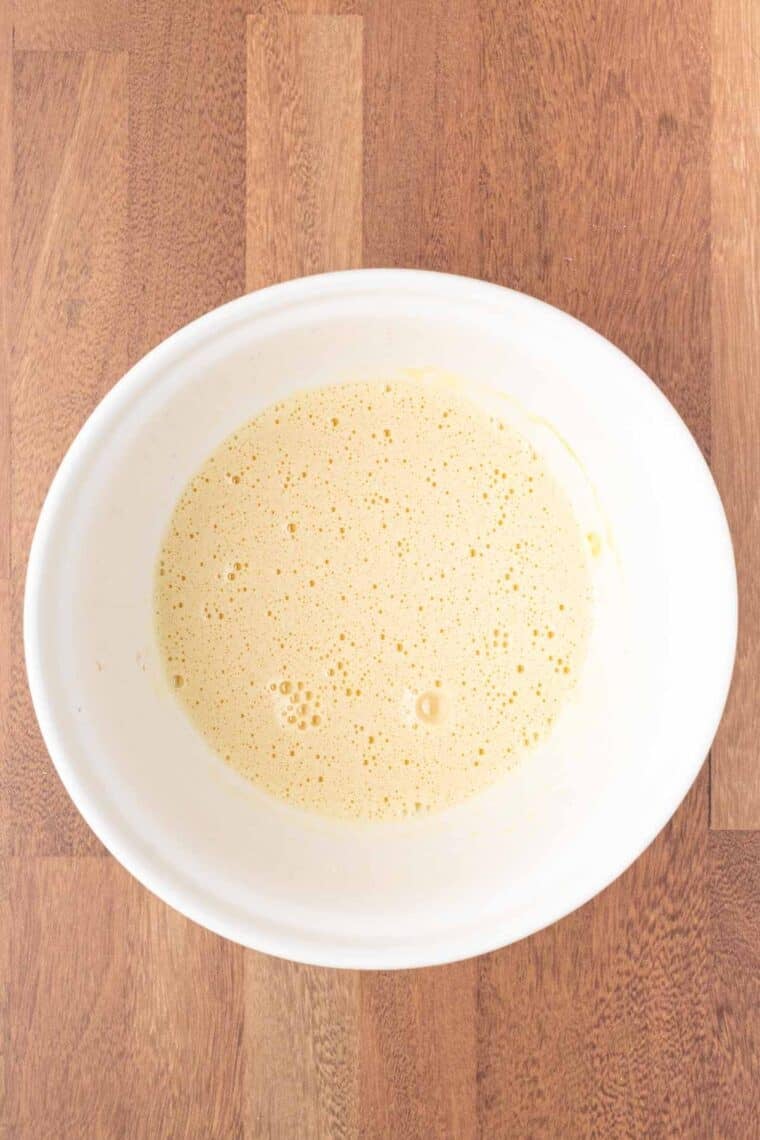 Eggs and oil mixed together in a bowl.