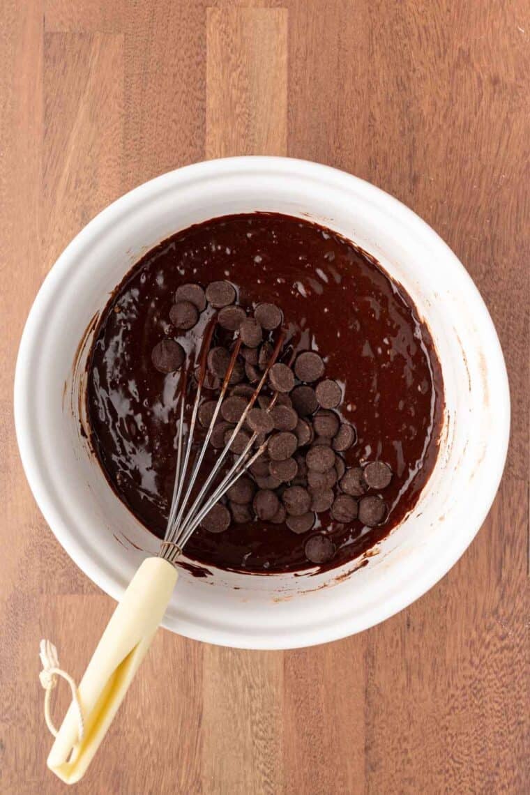 Chocolate chips are added to Mexican brownies batter.