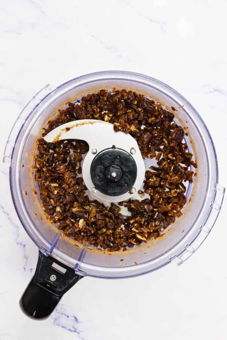 Pitted dates are processed in a food processor.