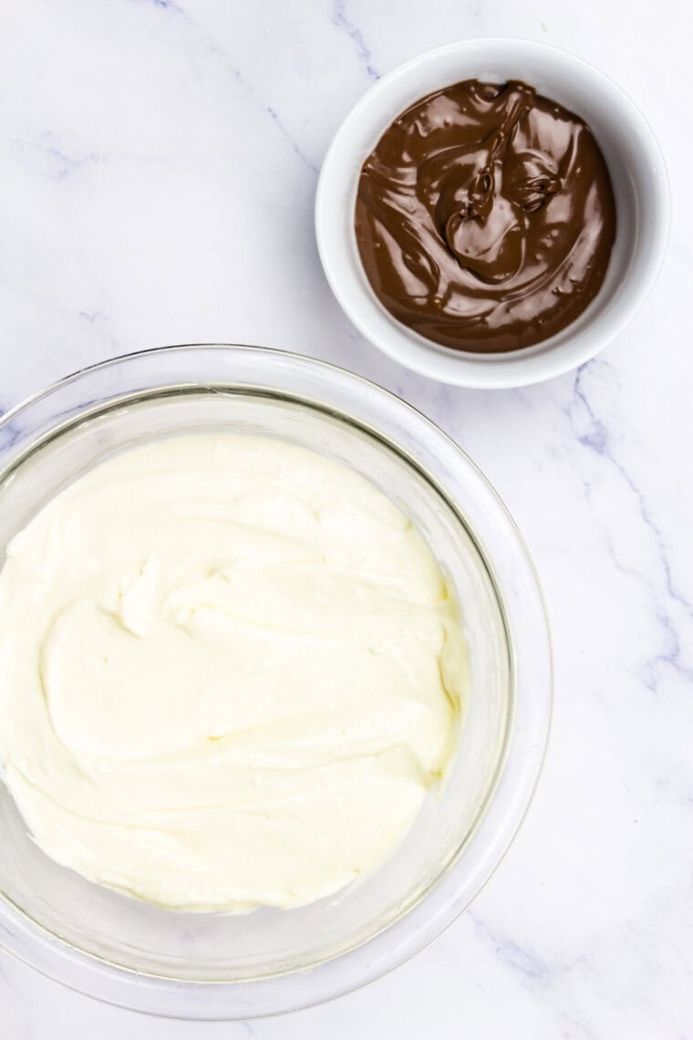 A bowl of cream cheese filling next to a bowl of Nutella.