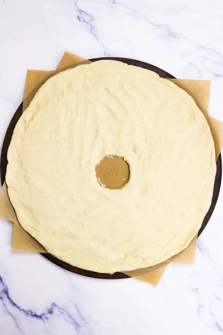 Gluten-free crescent dough is rolled into a round.