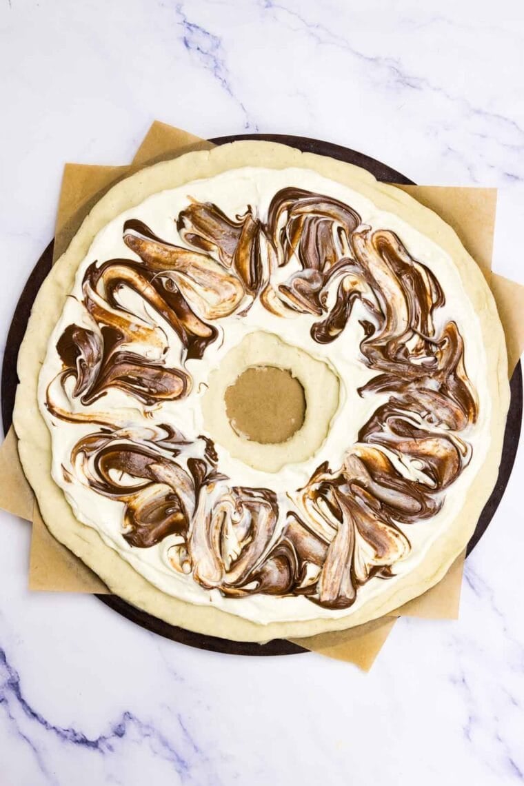 Nutella is swirled into cream cheese on a Nutella pastry.
