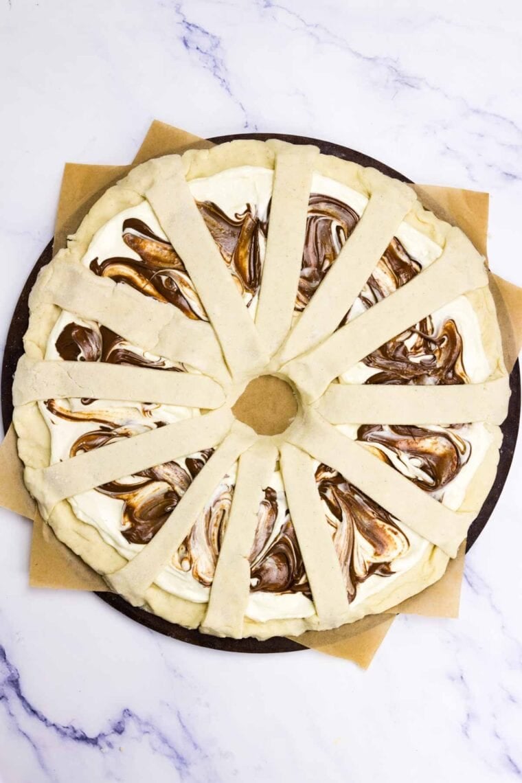 More dough is added to finish a Nutella pastry.