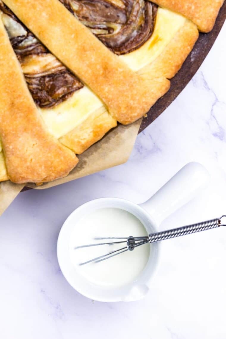 Icing for Nutella pastry whisked in a small bowl.