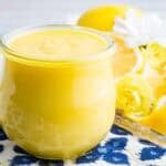 A bright yellow jar of homemade lemon curd.