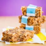 A stack of three no bake granola bars and a bar next to it.
