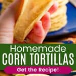 A hand folding a tortilla and a stack of tortillas on a blue plate divided by a green box with text overlay that says "Homemade Corn Tortillas" and the words "Get the Recipe!".