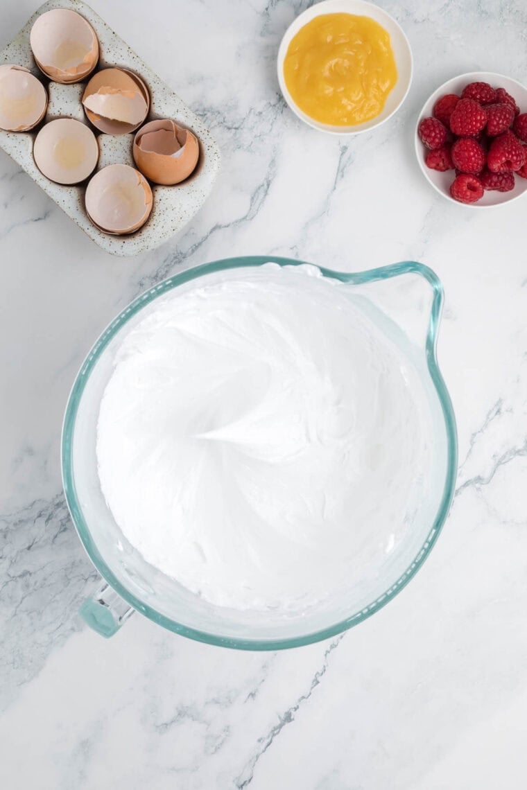 Egg whites are whipped to a meringue for pavlova.