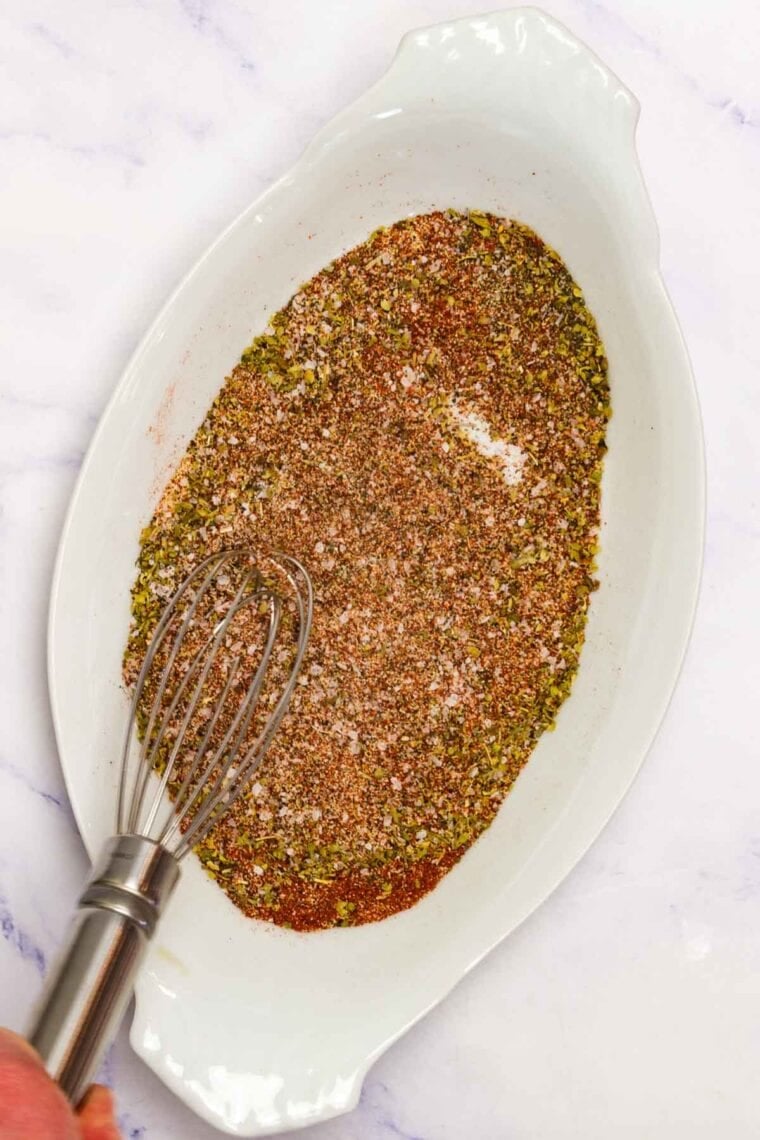 Seasonings are mixed together to make slow cooker pulled pork.